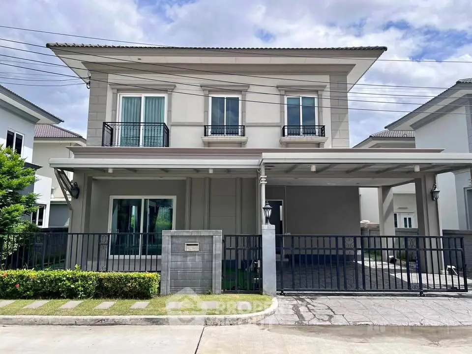 Modern two-story house with spacious driveway and elegant facade in a serene neighborhood.