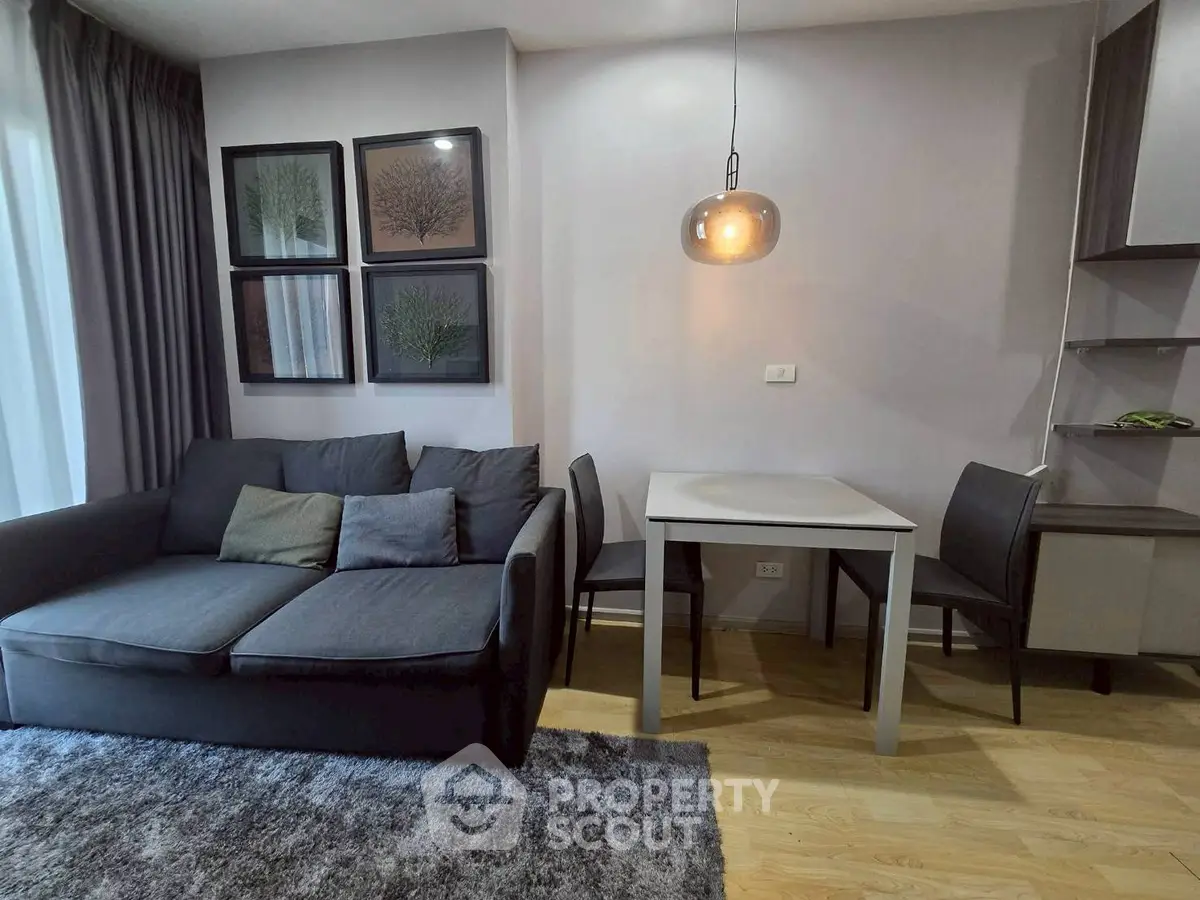 Modern living room with cozy sofa and dining area, perfect for urban living.
