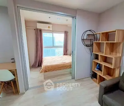 Modern apartment with cozy bedroom and stylish shelving unit