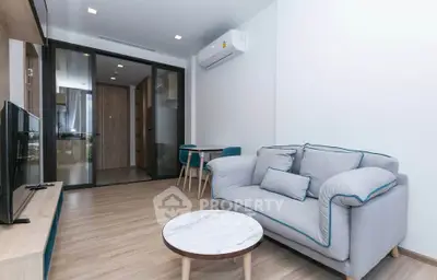 Modern living room with stylish furniture and air conditioning in a contemporary apartment.