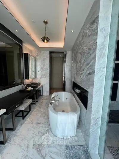 Luxurious marble bathroom with elegant bathtub and modern fixtures