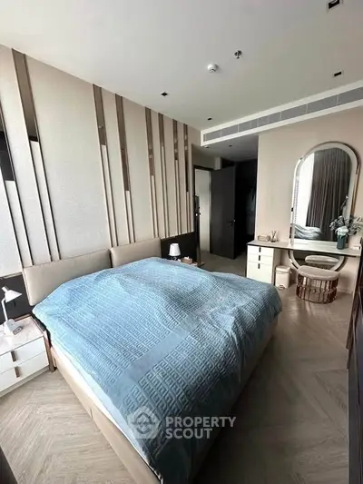 Luxurious bedroom with modern decor and elegant furnishings, featuring a cozy bed and stylish accents.