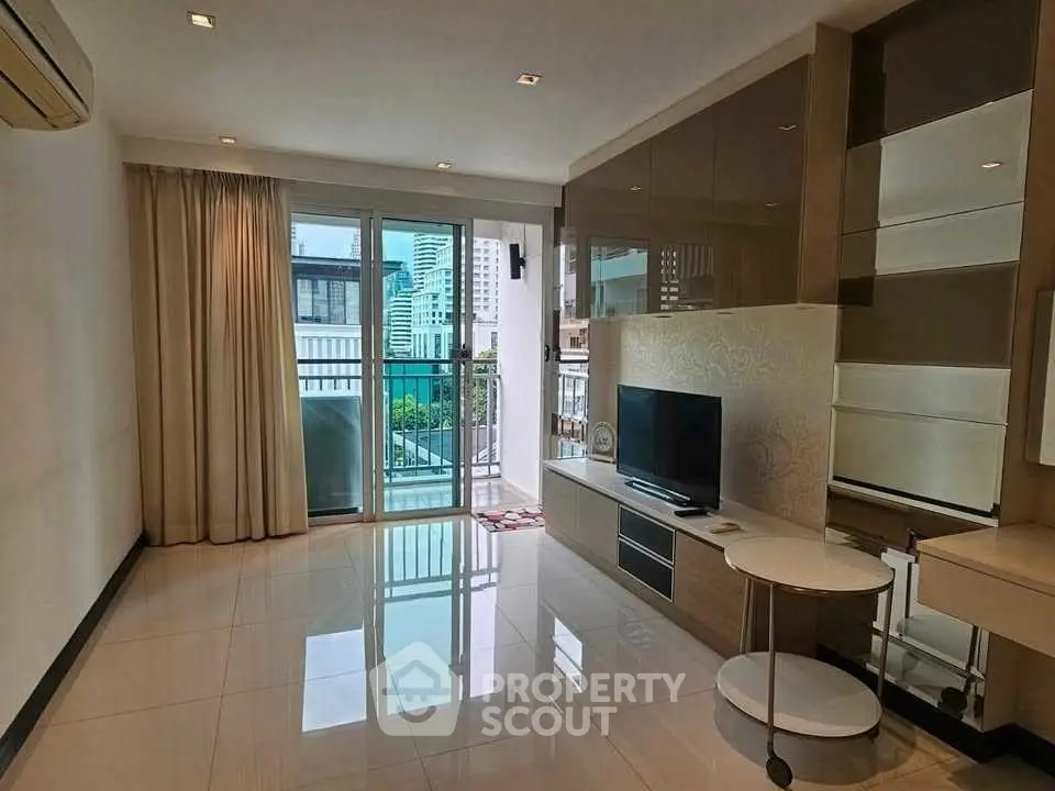 Modern living room with sleek design and city view balcony access.