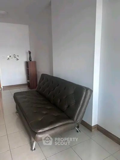 Modern living room with sleek leather sofa and minimalist decor