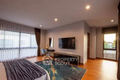 Spacious modern bedroom with large windows and stylish decor