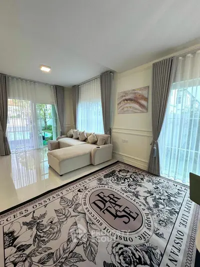 Elegant living room with modern decor and large windows for natural light.