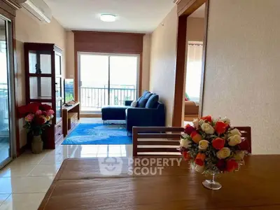 Spacious living room with modern decor and balcony view