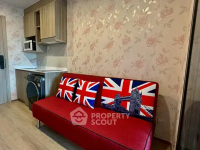 Charming apartment interior with stylish kitchen and cozy living area featuring unique decor.