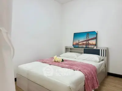 Cozy bedroom with modern decor and stylish wall art