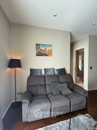 Cozy living room with plush gray sofa and modern decor