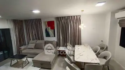 Modern living room with elegant dining area and stylish decor