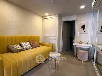 Stylish living room with yellow sofa and modern decor in a contemporary apartment.