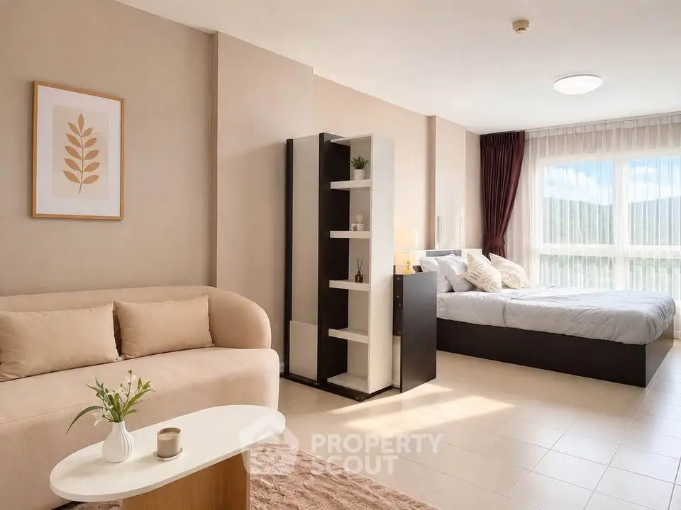 Spacious modern studio with natural light, cozy living area, and stylish decor.