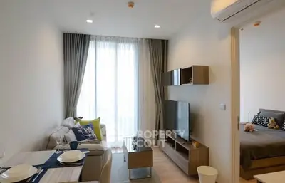 Modern living room with cozy dining area and stylish decor