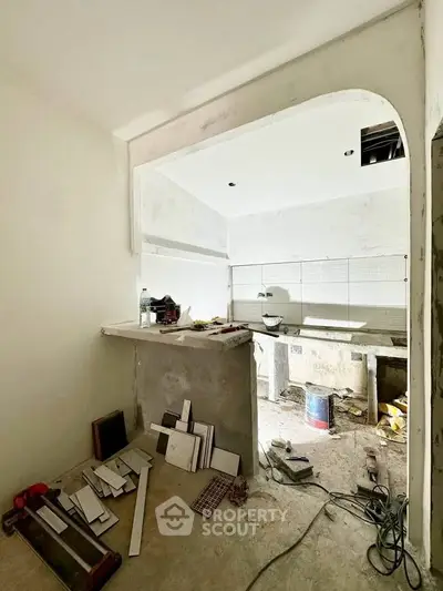 Under-construction kitchen with open layout and modern design potential.