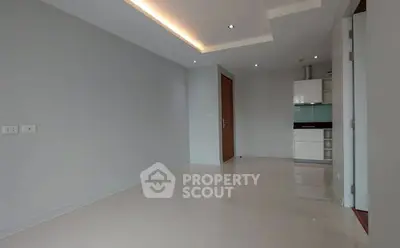 Spacious modern living room with sleek kitchen in open layout design