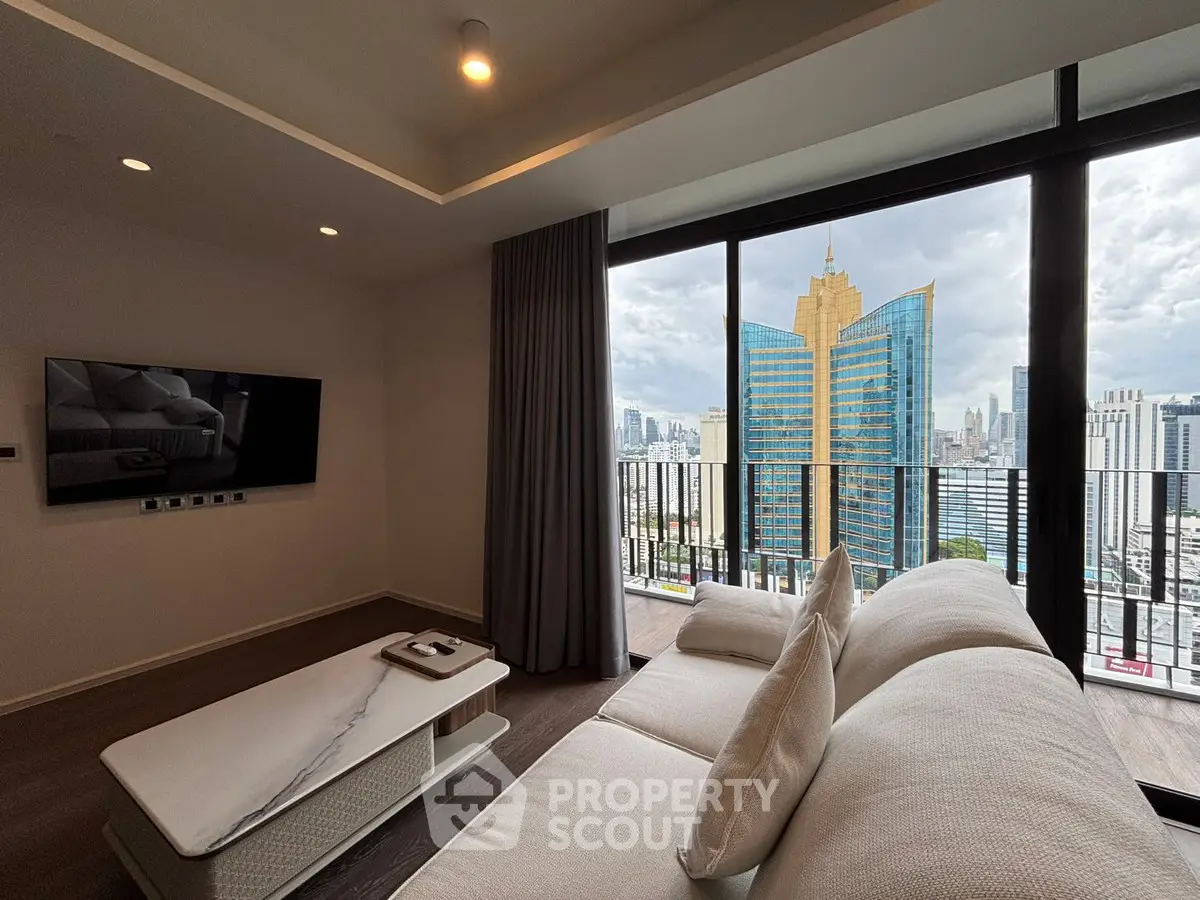 Luxurious living room with stunning city view and modern furnishings in high-rise apartment.