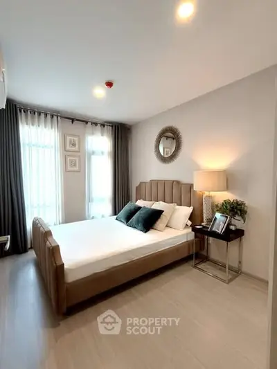 Modern bedroom with stylish decor and natural light