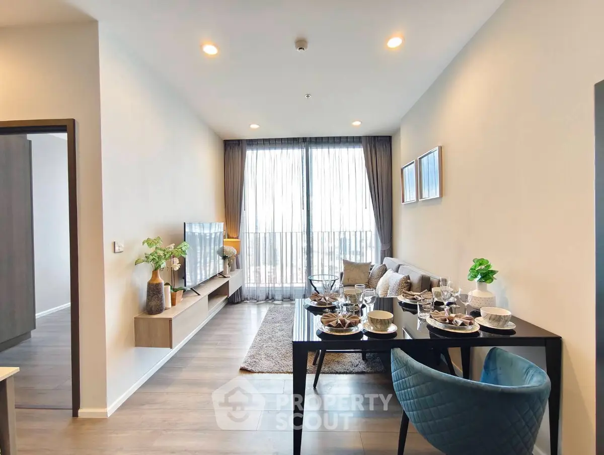 Modern living room with elegant dining area and large window view
