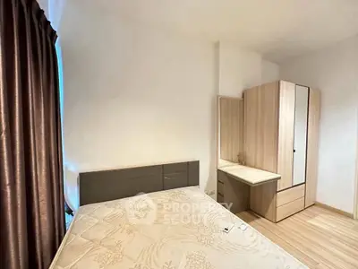 Cozy bedroom with modern wardrobe and elegant curtains