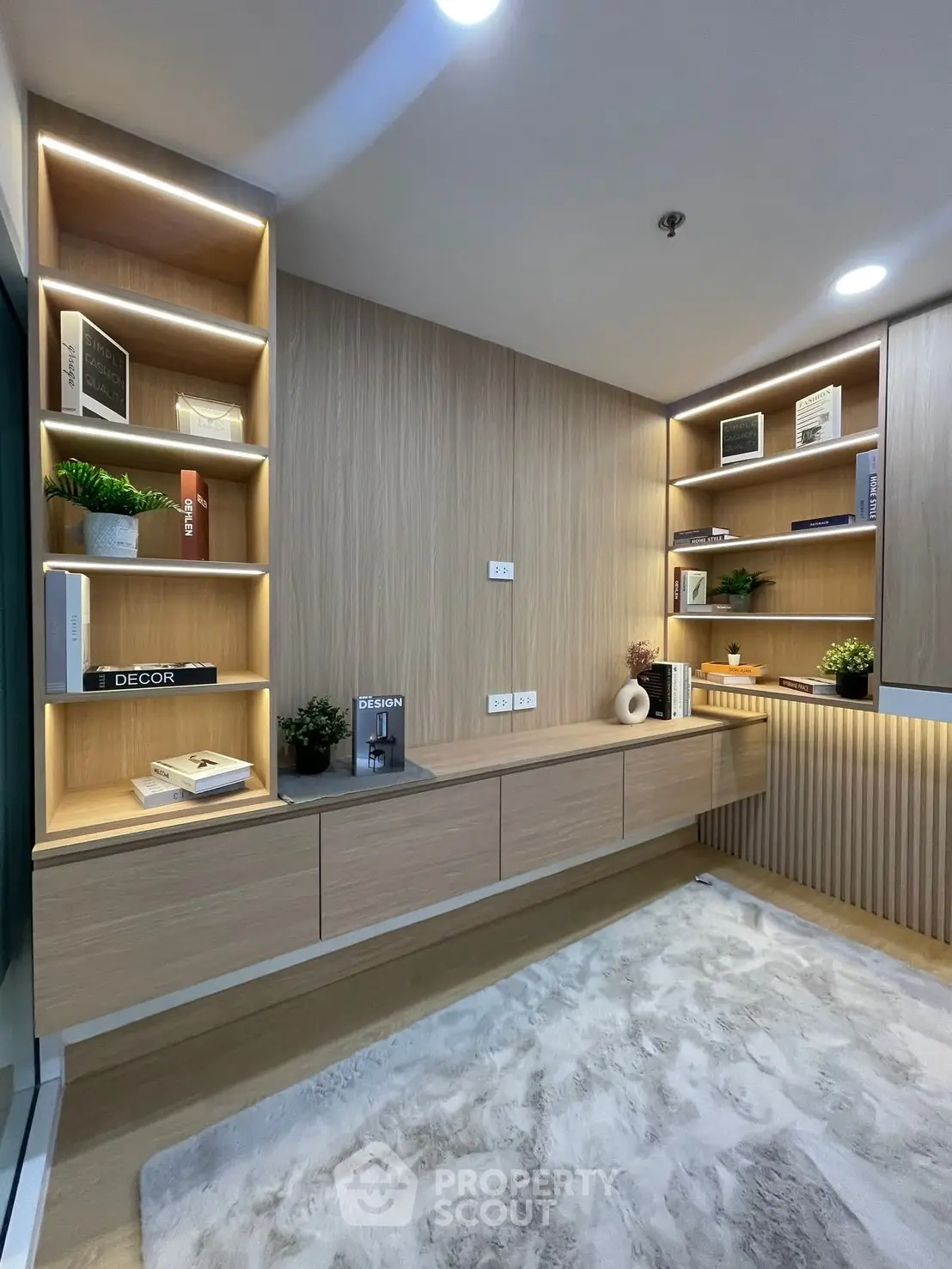 Modern study room with built-in shelves and stylish decor