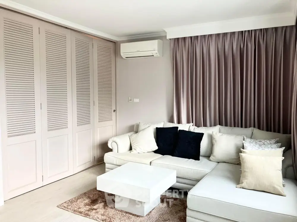 Elegant living room with modern sofa and stylish curtains