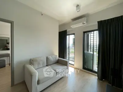 Modern living room with cozy sofa and balcony view in a stylish apartment