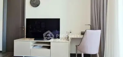 Modern living room with sleek TV unit and stylish desk setup
