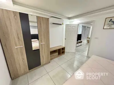 Modern bedroom with stylish wardrobe and air conditioning unit