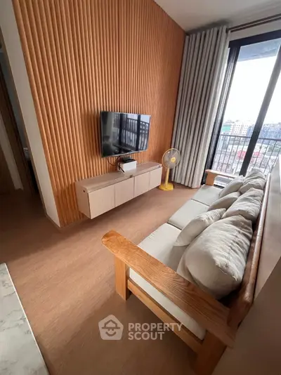 Modern living room with wooden accents and large window view