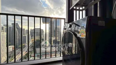 Stunning city view from a modern apartment balcony with washing machine.