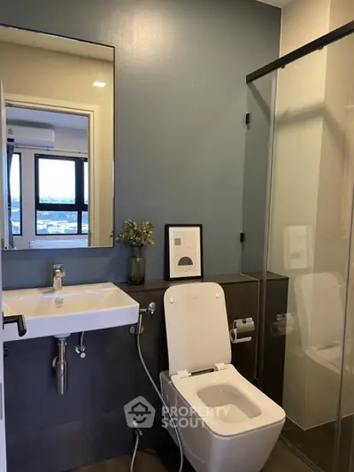 Modern bathroom with sleek design and glass shower enclosure