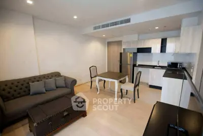 Modern open-plan living room with stylish kitchen and cozy seating area