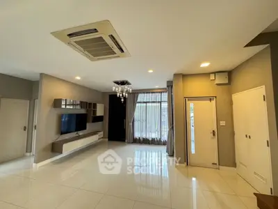 Spacious modern living room with sleek design and large windows