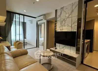 Modern living room with marble accent wall and open layout