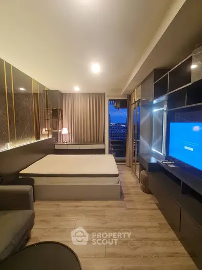 Modern bedroom with stylish decor and city view from balcony