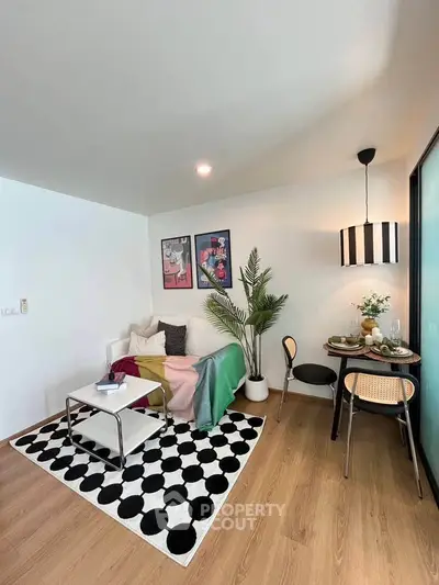 Chic modern living room with stylish decor and cozy seating area.