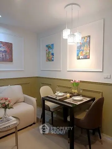 Charming dining area with elegant decor and cozy seating in a stylish apartment.