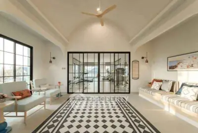 Spacious living room with modern decor and large windows