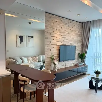 Modern living room with stylish decor and wall-mounted TV