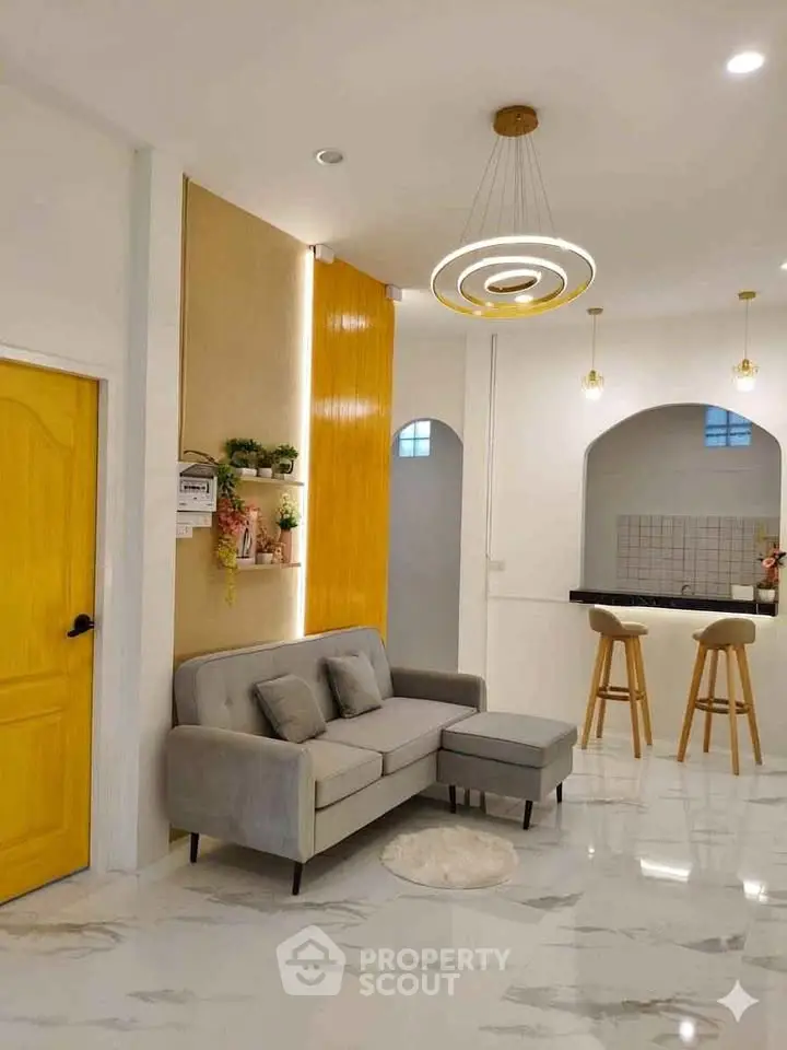 Modern living room with stylish decor and open kitchen layout