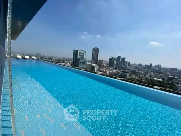 Stunning rooftop infinity pool with breathtaking city skyline view.