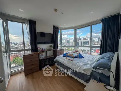 Stunning bedroom with panoramic city view and modern furnishings