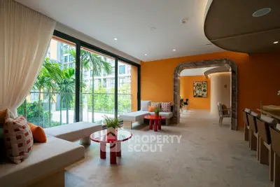 Spacious modern living room with large windows and stylish decor