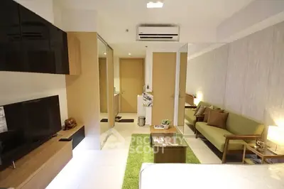 Modern living room with sleek design and cozy furniture in a stylish apartment.