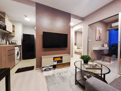 Modern living room with open kitchen and stylish decor