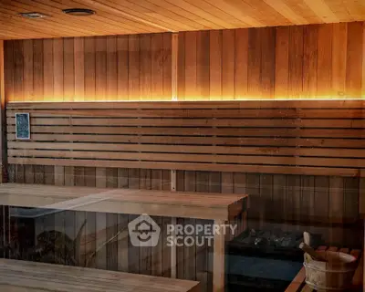 Luxurious sauna room with wooden benches and ambient lighting