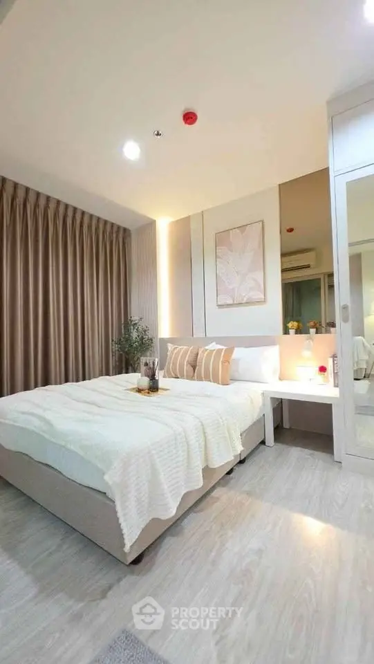 Modern bedroom with cozy decor and elegant lighting