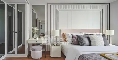 Luxurious modern bedroom with elegant decor and ample natural light