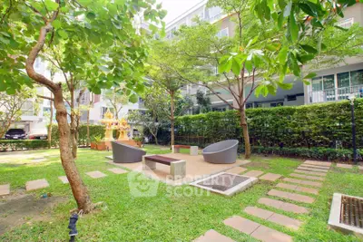 Beautiful garden area with modern seating in a residential complex